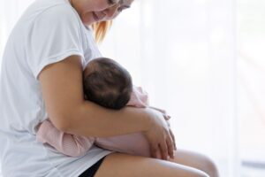 pregnancy; a mother breastfeeding her baby