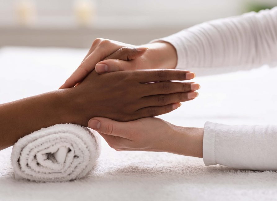 Power of reflexology, a reflexology hand massage in progress.
